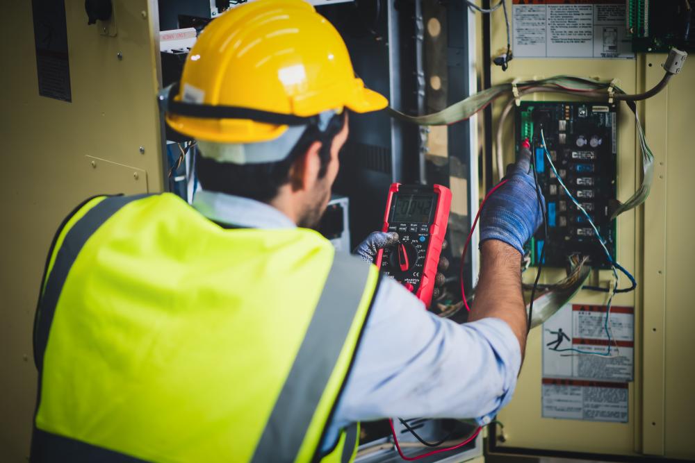 Electrician testing an electrical panel